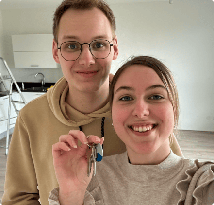 Couple holding the keys to their new rental home